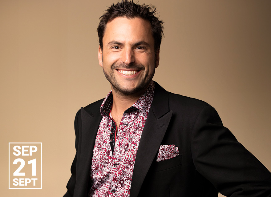 The image shows pianist Jean-Philippe Sylvestre with a friendly smile, dressed in a dark blazer over a patterned shirt with a matching pocket square. The text "SEP 21 SEPT" is displayed in white at the bottom left corner.