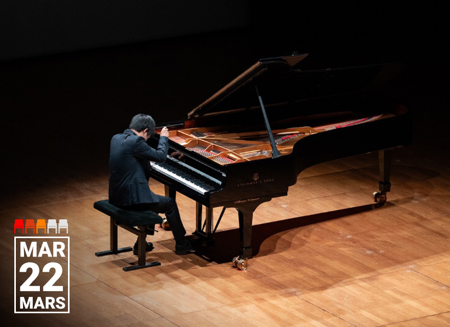 A pianist performs on a grand Steinway & Sons piano on a dimly lit stage. The musician leans forward, deeply focused on the keys, with the piano lid fully open. The event date, "March 22 (Mars)" is displayed in bold text in the bottom left corner, accompanied by a visual seating arrangement legend.